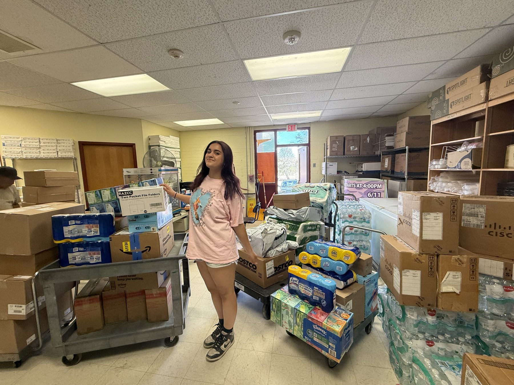 Nishka Makkar with donated supplies at Cottonwood Day School
